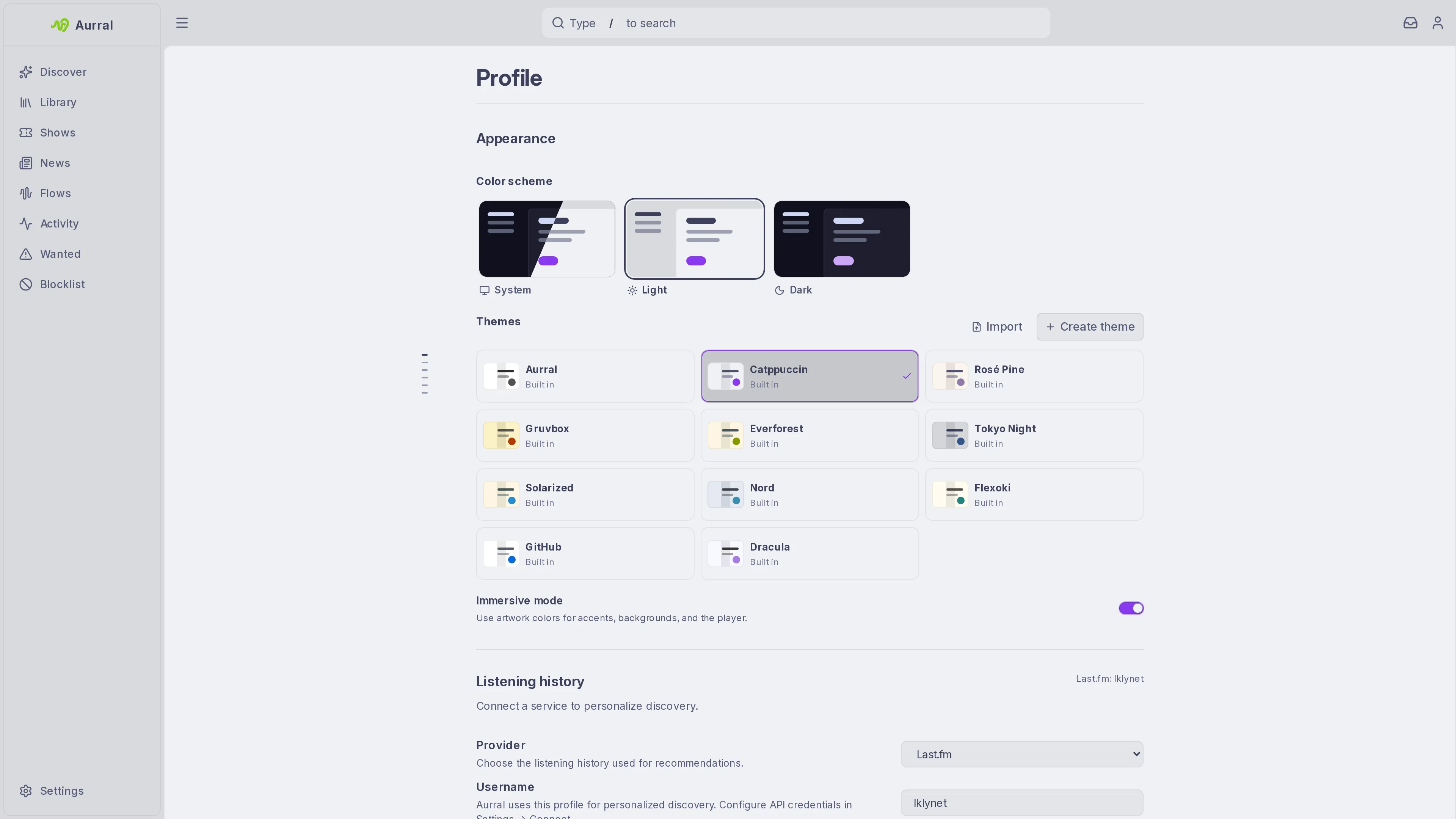 Aurral in the Catppuccin light theme, with the theme picker